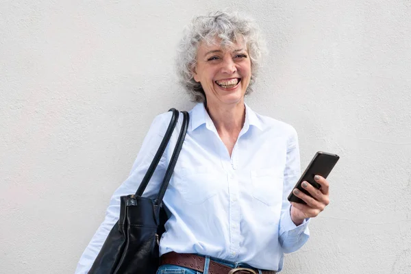 Portrait Middle Aged Woman Smiling Bag Mobile Phone White Background — Stock Photo, Image