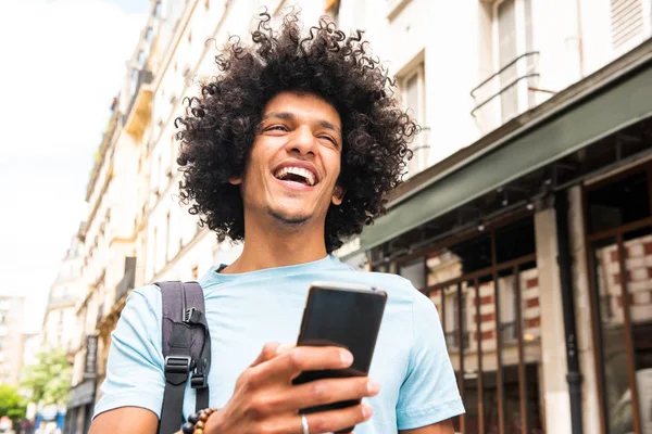 Portrait Smiling Young Arab Man Walking City Looking Mobile Phone — Stock Photo, Image