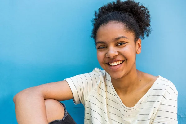 Close Portrait Happy Young African American Girl Sitting Blue Background — Stock Photo, Image