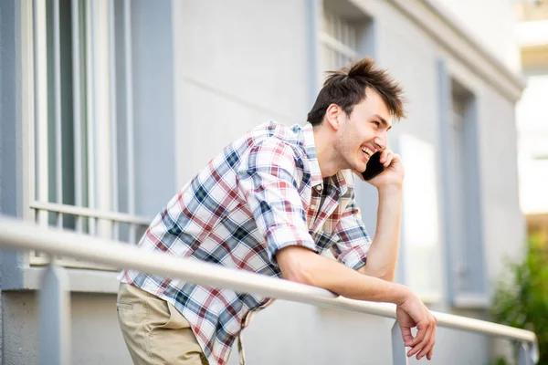 Portrait Relaxed Young Man Smiling Talking Cellphone Balcony — Stock Photo, Image