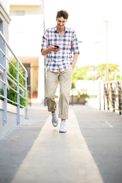 Full Length Portrait Happy Young Man Walking Mobile Phone — Stock Photo, Image