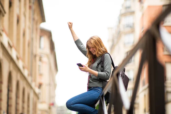 Side Portrait Happy Young Woman Looking Mobile Phone Arm Raised — Stockfoto