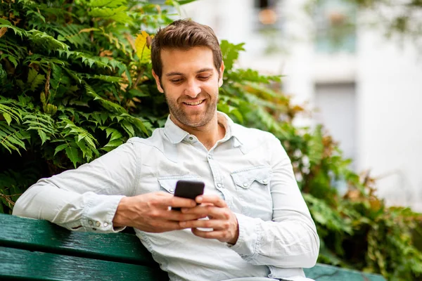 Close Portrait Handsome Man Sitting Park Bench Looking Mobile Phone — Stock Photo, Image