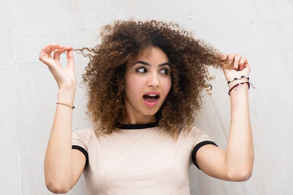 Close Portrait Young African American Woman Holding Curly Hair Surprised — Stock Photo, Image