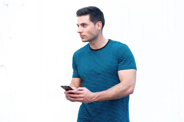 Side Portrait Handsome Young Man Holding Cellphone White Background — Stock Photo, Image