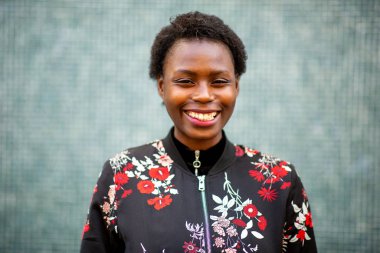 Close up portrait of happy young african woman smiling