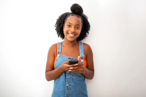 Portrait Smiling Black Girl Holding Mobile Phone White Wall — Stock Photo, Image