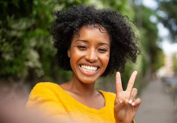 Close Young African Woman Taking Selfie Outdoors Peace Hand Sign — Stock Photo, Image