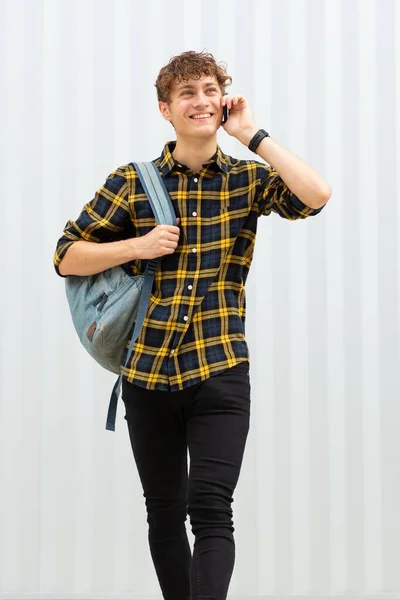 Portrait Happy Young Man Walking Bag Talking Cellphone White Background — Stock Photo, Image