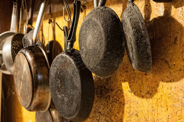 Old pans hanging on the wall