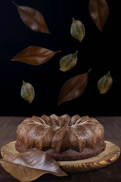 Delicious Chocolate Sponge Cake Wooden Plate Table Which Dry Leaves — Stock Photo, Image