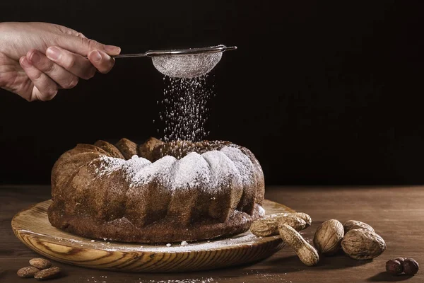 Hand Woman Pouring Icing Sugar Top Delicious Chocolate Sponge Cake — Stock Photo, Image