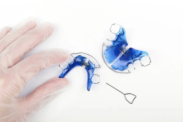 Orthodontist Hand Disposable Gloves Holds Orthodontic Appliance Children White Table — Stock Photo, Image
