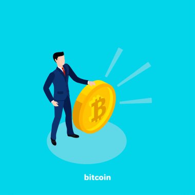 büyük bir bitcoin, izometrik görüntü yanında iş elbiseli bir adam