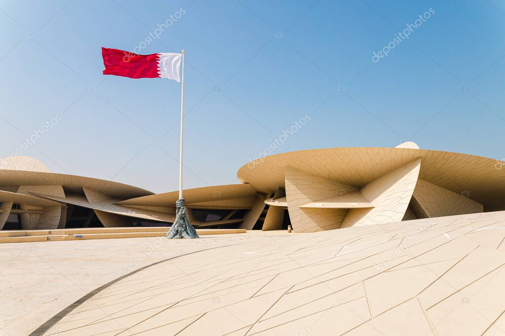 Doha, Qatar - March 2, 2020: Modern contemporary architecture National Museum of Qatar by Jean Nouvel in Doha city with blue sky background