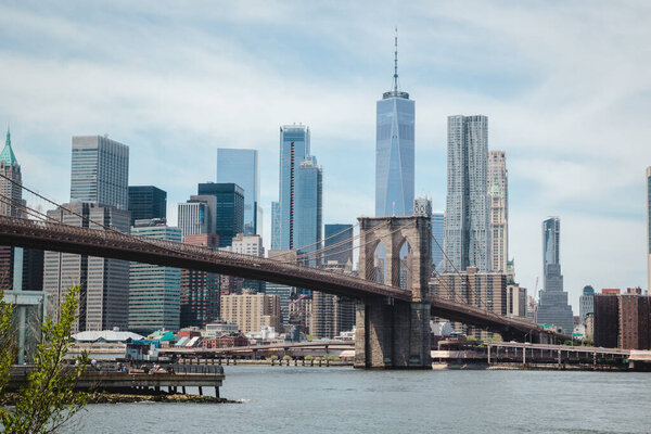 Brooklyn bridge and Manhattan cityscape, view on New York downtown from Dumbo, Brooklyn, USA