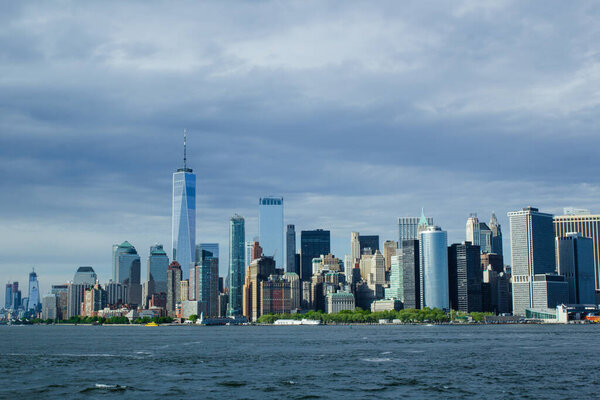 View on Manhattan skyline with blue sky background, New York cityscape, towns of USA