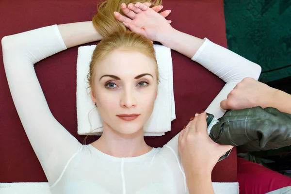 Body massage by LPG therapy apparatus. LPG massage hands of a young woman.