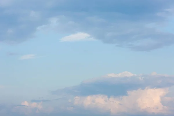 Thick clouds in the sky. Cloudy weather with clouds and clouds. On the sky clouds.