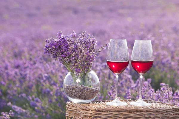 Wine glass against lavender. — Stock Photo, Image