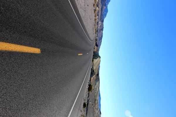 Road in the Death Valley National Park with blue sky background, California — Stock Photo, Image