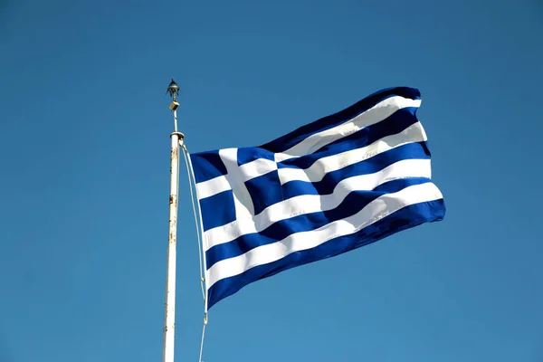 National flag of Greece against blue sky background — Stock Photo, Image