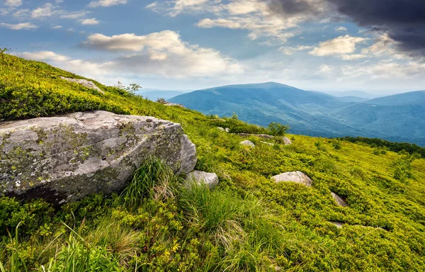 Boulder on the grassy hillside — Stock Photo, Image