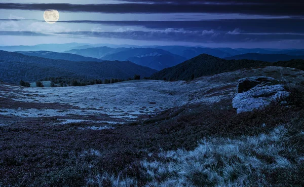 Huge boulders on the edge of hillside at night — Stock Photo, Image