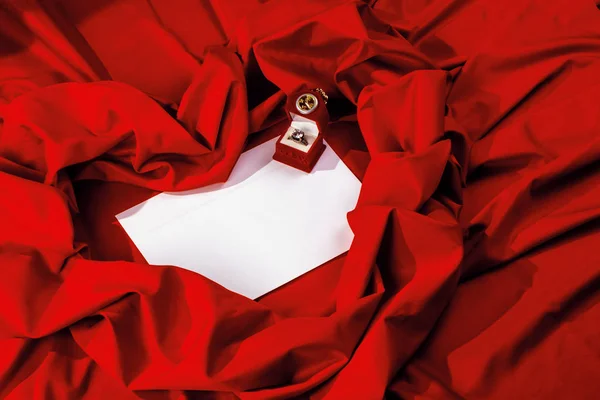 Valentine card composition on a red fabric — Stock Photo, Image