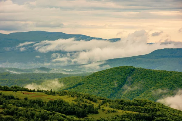 Clouds rising above the hills — Stock Photo, Image