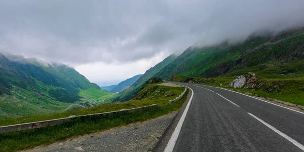 alpine road through mountain valley