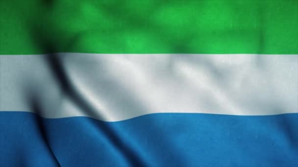 Флаг Сьерра-Леоне размахивает на ветру. Государственный флаг Сьерра-Леоне. Знак анимации бесшовного цикла Сьерра-Леоне. 4K — стоковое видео