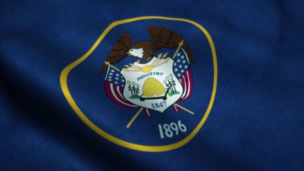 ユタ州の旗が風になびく。ユタ州の国旗。ユタ州のシームレスなループアニメーションのサイン。4K — ストック動画