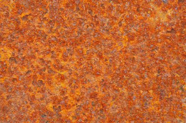 Pas içindeki demir yüzey. Endüstriyel sektörlerin düşüşü. Rusty America Kuşağı. Metal aşınması. Kırmızı arkaplan ya da duvar kağıdı. Kontrastı düşürdüm. Yukarıdan bak. Yakın plan.