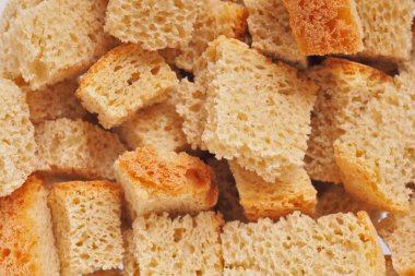 Taze ev yapımı krakerlerin yüzeyi. Açık sarı arka plan ya da yiyecekten duvar kağıdı. Yukarıdan bak. Kontrastı düşürdüm. Makro