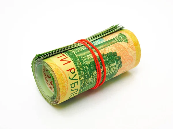 A rolled up bundle of Russian banknotes of 200 rubles lies on a white paper background. Denominations are connected by an elastic band. Not isolated. Microcredit organizations and collection agencies
