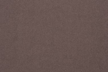 Kahverengi kağıt. Koyu arkaplan ya da duvar kağıdı. Yüzey dokusu, lifler ve düzensizlikler görülebilir. Yukarıdan görüntüle