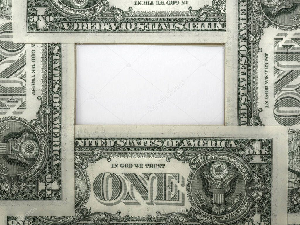 American dollars with place for text. 1 dollar bills on the reverse side are laid out in a ring and form a copy-space. White paper surface in the center. Aged effect shot