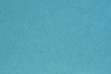 Açık mavi karton yüzeyi. Selüloz lifli pürüzlü doğal kağıt dokusu. Arkaplan ya da duvar kağıdı. Yukarıdan yukarıdan bir görüntü. Makro