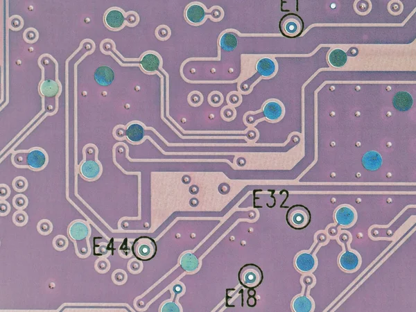 Printed circuit board PCB hard drive. Fragment of printed wiring board PWB close up. Conductive pattern. Background or wallpaper for theme computer hardware and equipment. Inverted image. Strong macro