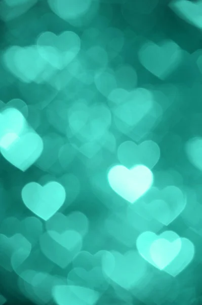 Emerald heart bokeh background photo, abstract holiday backdrop — Stock Photo, Image