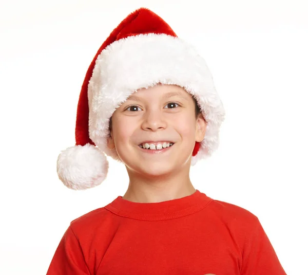 Boy child portrait in santa hat, having fun and emotions, winter holiday concept Stock Photo