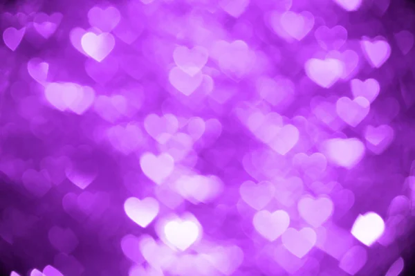 Purple heart bokeh zdjęcie w tle, tło wakacje z abstrakcyjna — Zdjęcie stockowe