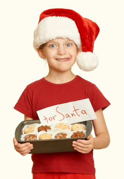 Το κορίτσι με τα cookies για Σάντα, χειμερινές διακοπές Χριστουγέννων έννοια, κίτρινο τονισμένο — Φωτογραφία Αρχείου