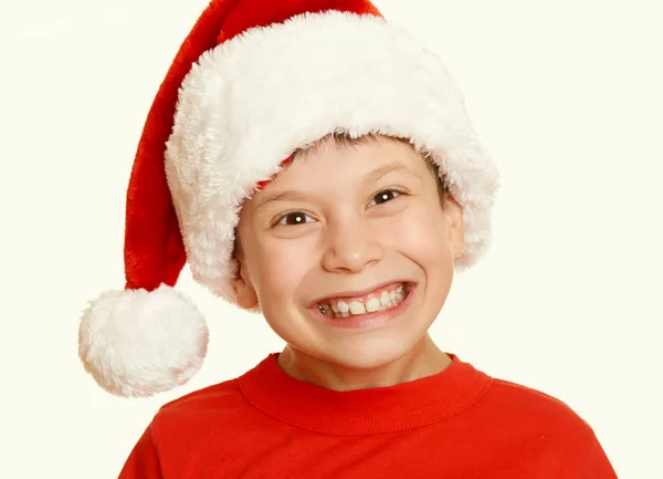 Chłopiec dziecko portret w santa hat, zabawy i emocji, koncepcja wakacje zimowe, żółty stonowanych — Zdjęcie stockowe