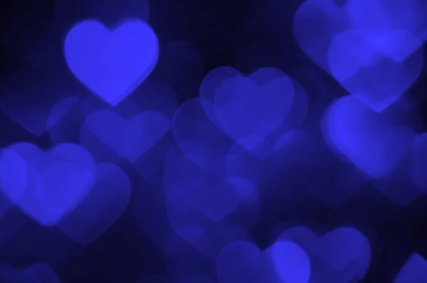 Ciemno niebieskie serce bokeh zdjęcie w tle, tło wakacje z abstrakcyjna — Zdjęcie stockowe