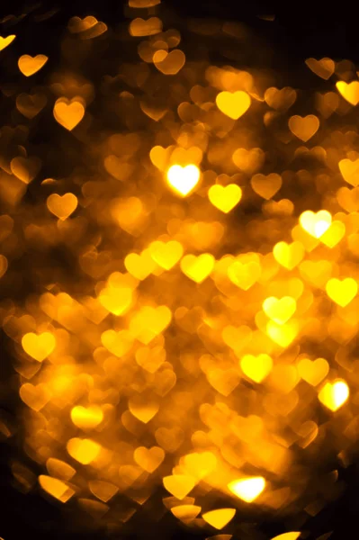 Golden color heart bokeh background photo. Abstract holiday, celebration backdrop. — Stock Photo, Image