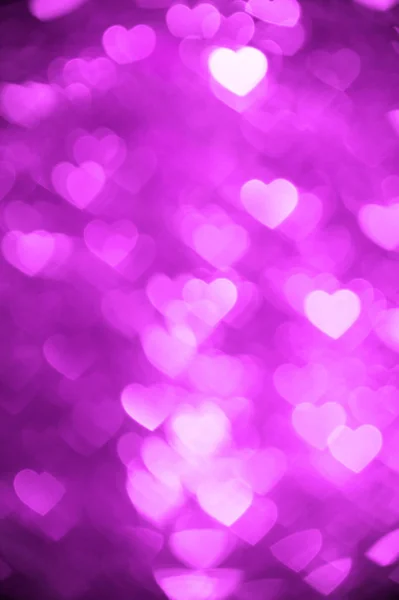 Magenta hart bokeh achtergrond kleurenfoto. Abstracte vakantie, feest achtergrond. — Stockfoto