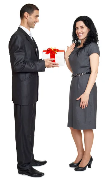 Romantic couple with gift box, people dressed in black suit, man gives gift to woman, isolated on white background — Stock Photo, Image