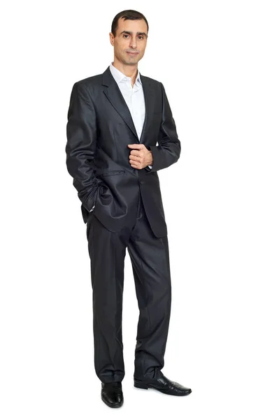 Erwachsener Mann im schwarzen Anzug posiert, weißer Hintergrund — Stockfoto